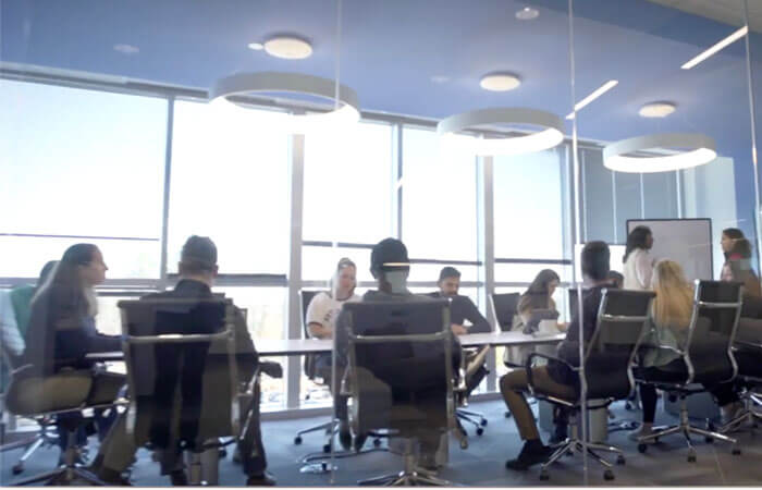 board members around a conference room table