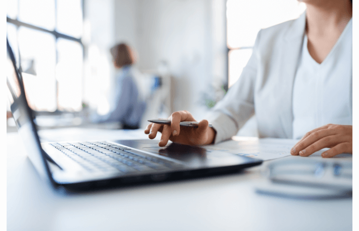 business woman typing on laptop
